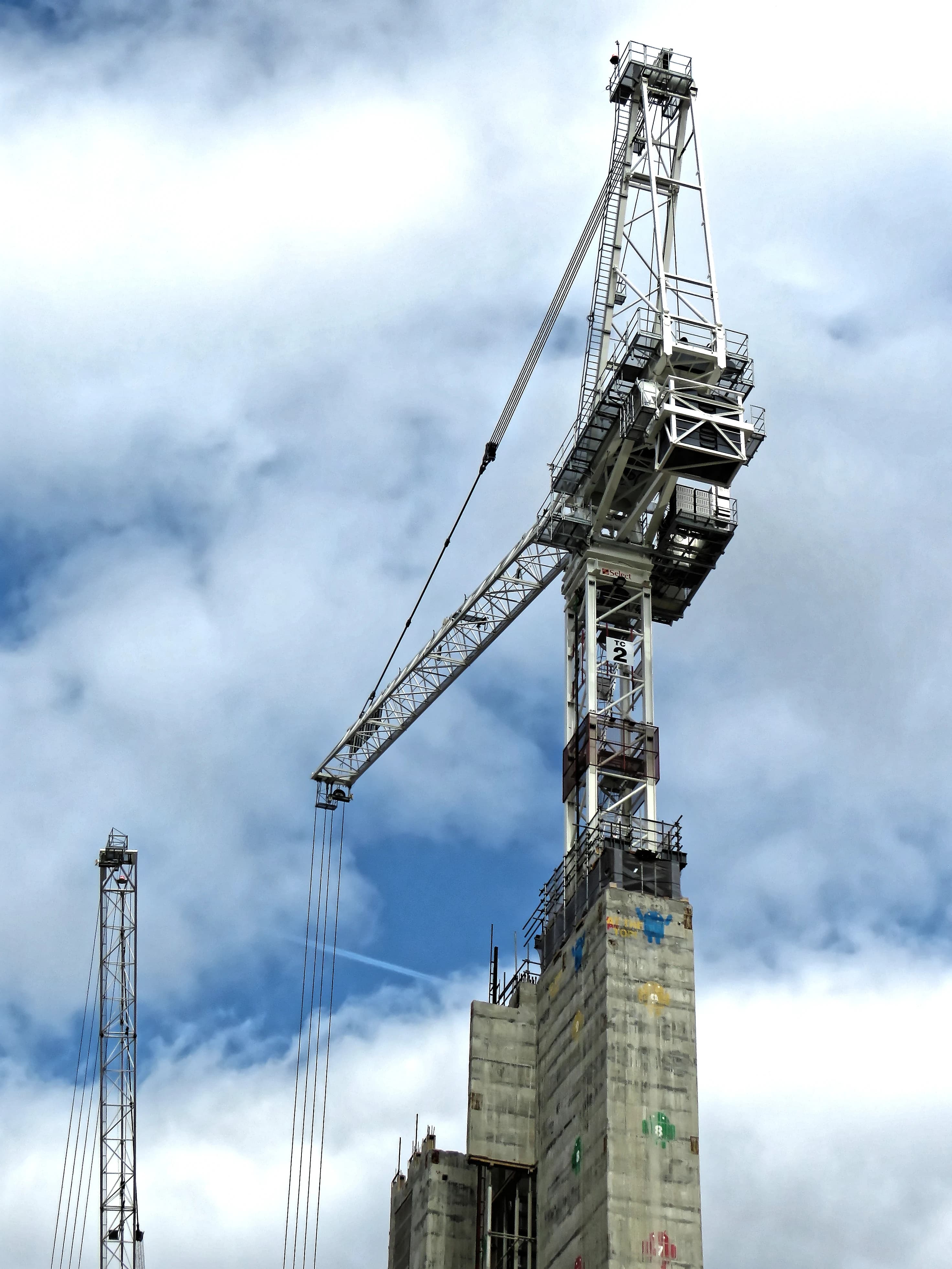 High-rise construction site with cranes and structural work